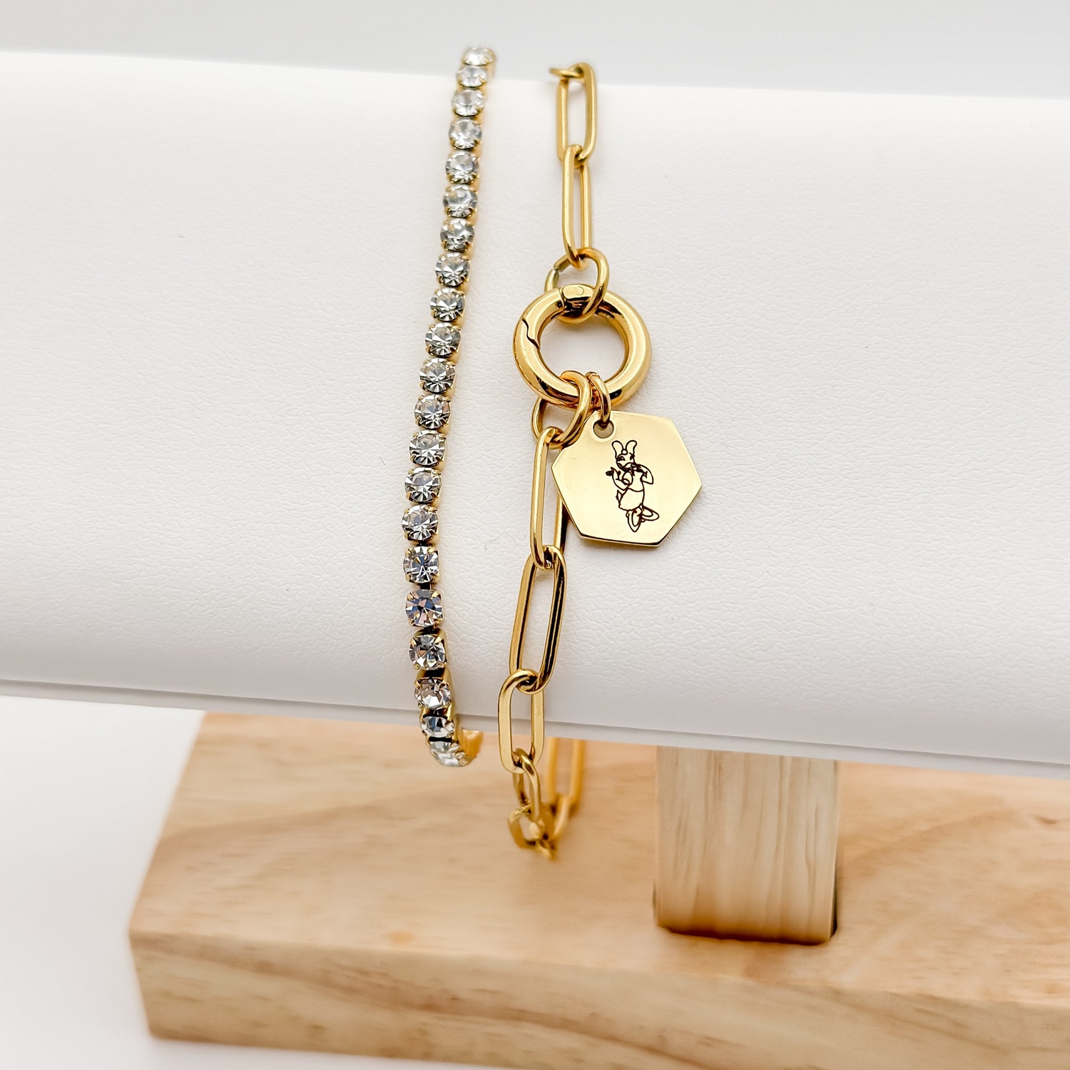 gold minimalist charm bracelet on a paperclip chain with gold charm keeper. Engraved with miss duck image.