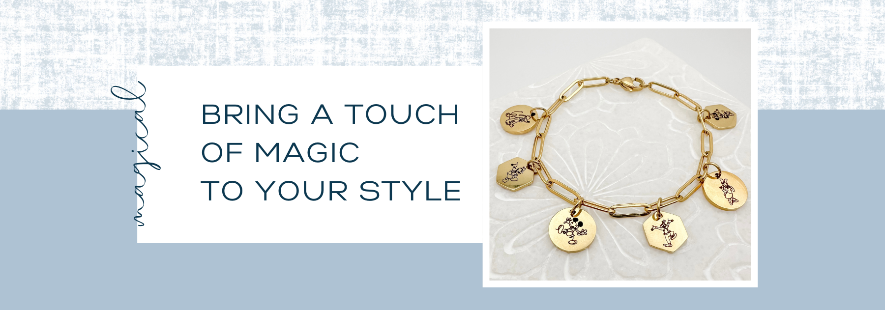 Gold bracelet with charms on a textured surface, accompanied by text 'Bring a touch of magic to your style'.